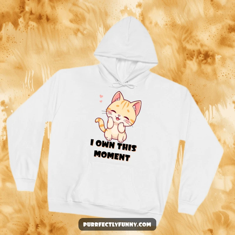 Funny hoodie with a cute cat character actively batting at a single, errant whisker, illustrating a moment of playful, cartoonish obsession.