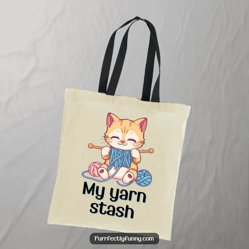 Funny cat hilariously knitting with oversized yarn and needles on a practical and humorous funny tote bag.